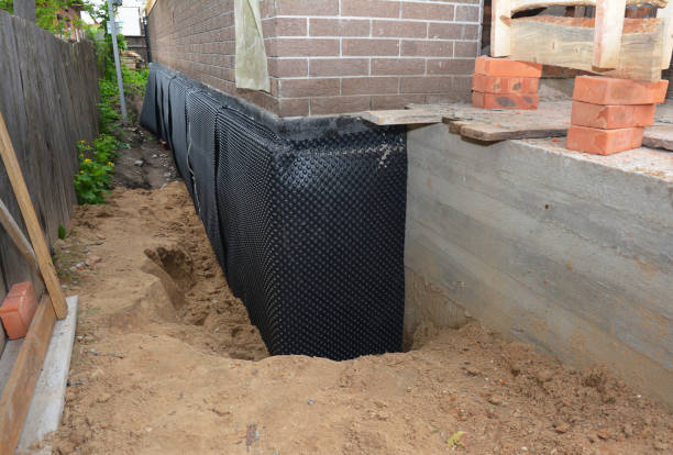 SJ Waterproofing Pros technician performing targeted Interior Drainage System assessment in Augusta, WI